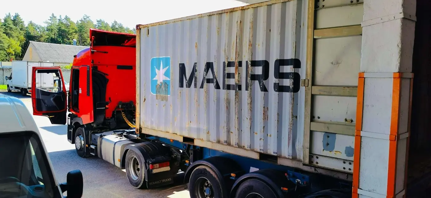 Loading shipment for overseas relocation by international moving company in Lithuania
